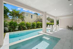 a swimming pool in the middle of a house at Pearl House at The Gemma by Brightwild in Clearwater Beach