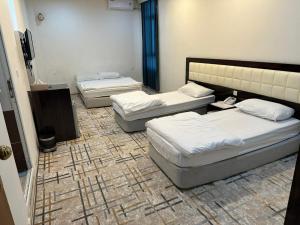 Katil atau katil-katil dalam bilik di Athena Stars Hotel