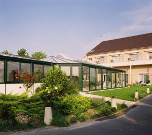 En have udenfor Hostellerie Du Mont Aimé