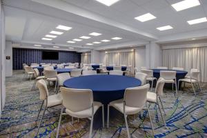 a conference room with blue tables and white chairs at Hampton Inn Queen Creek, AZ in Queen Creek