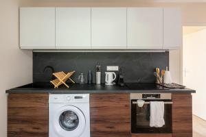 Kuchyň nebo kuchyňský kout v ubytování Pépoule - Appartements avec vue sur les monts du Beaujolais