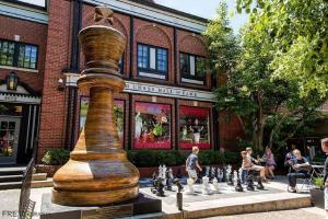 a statue of a water jug and a chess board at Cozy Studio w Pool & WFH Setup St Louis in Tower Grove