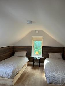 A bed or beds in a room at Jacob’s Lodge