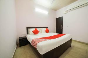 Postel nebo postele na pokoji v ubytování Hotel O Iris Lite