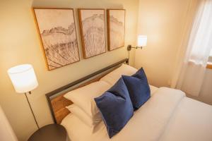 A bed or beds in a room at Cozy Nook: Work Hard, Play Harder in Lander, WY!