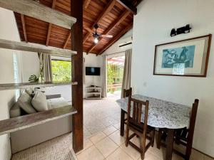 a dining room with a table and a table and chairs at Pousada do Riacho Trindade in Trindade