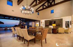 a dining room with a table and chairs at Firepit Sunsets, Hot Tub Soaks, BBQ, Ocean Views in San José del Cabo