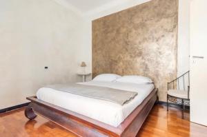 Säng eller sängar i ett rum på Mydollhouse delizioso appartamento fronte mare