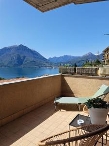 a balcony with a view of a lake and mountains at La casa di Guia in Perledo