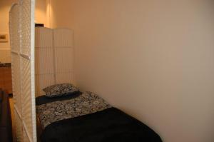 En eller flere senge i et værelse på Blu Apartament
