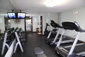 a gym with several tread machines in a room at Radisson Hotel Schaumburg in Schaumburg