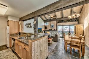 a kitchen with a sink and a dining room at Lakeland Village 462 - Walk to Lake Rustic 2.5BR in South Lake Tahoe