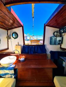 a desk in a boat with a lamp on it at SANTIAGO- Boat House in Olhão