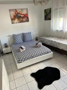 a bedroom with a bed and a rug on the floor at MONA LISA in Cagnes-sur-Mer