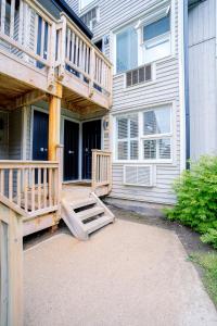 a deck on the side of a house at Gorgeous Studio Condo in Blue Mountains Sleeps 4 in Blue Mountains