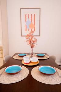 a table with plates and bowls on top of it at Dante95 in Polignano a Mare +6 photos