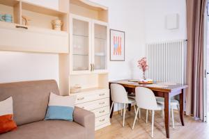 a kitchen and dining room with a table and chairs at Dante95 in Polignano a Mare