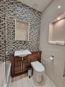Kúpeľňa v ubytovaní Selfridges Deluxe Apartments