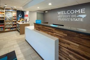 a store lobby with a welcome to the first in flight state at Hampton Inn Asheville-Tunnel Road in Asheville