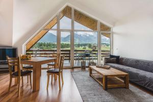 a living room with a couch and a table at Local Stay Hotel, BW Signature Collection in Bansko