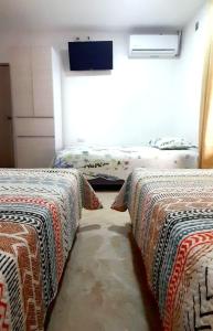 Een bed of bedden in een kamer bij Hotel Luxury Plaza