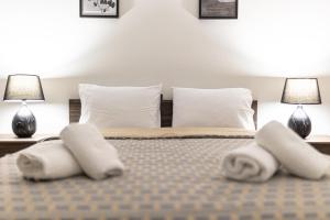 A bed or beds in a room at Arados family Residence