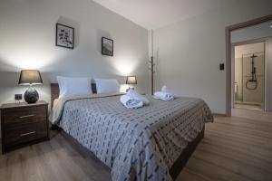 A bed or beds in a room at Arados family Residence