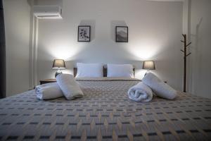 A bed or beds in a room at Arados family Residence