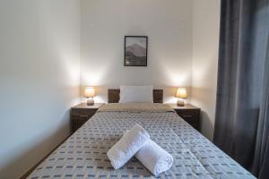 Postel nebo postele na pokoji v ubytování Arados family Residence