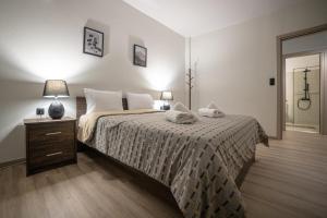 A bed or beds in a room at Arados family Residence