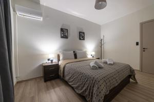 A bed or beds in a room at Arados family Residence