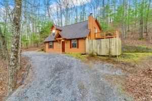 a cabin in the woods on a dirt road at Mountain Bliss in Townsend