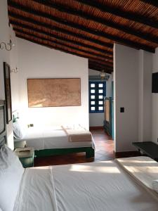 Katil atau katil-katil dalam bilik di Casa Silva - Hotel Cafe