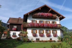 a house with flower boxes on the side of it at Landhaus Kamml in Anger