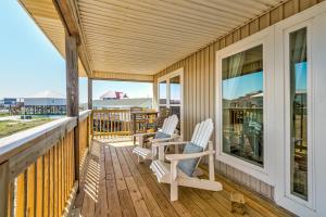 two chairs on a porch with a view of the ocean at Just Chillin' in Dauphin Island