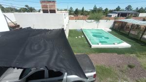 Un paraguas negro encima de un pequeño ficialificialificialificialificialificialificialificialificial en COMPLEJO MAINUMBI DUPLEX 5, en Mercedes