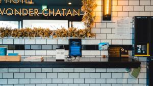 a sign for a wonder chan restaurant on a wall at Blue Steak Wonder Chatan in Chatan