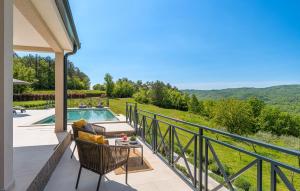 a patio with a table and chairs and a swimming pool at Stunning Home In Hum With Sauna in Hum