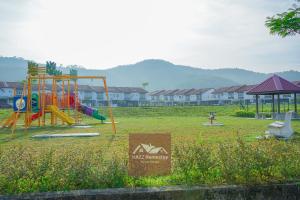 a park with a playground with a play equipment at HAZZ Homestay Kulim in Kulim