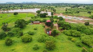 an aerial view of a field with a river at Animal View Point Yala in Tissamaharama