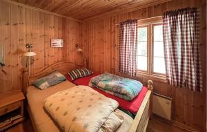 Ένα ή περισσότερα κρεβάτια σε δωμάτιο στο 3 Bedroom Stunning Home In Øyer