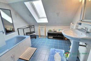 a bathroom with a sink and a bath tub at Villa cafe marrec in Port-Louis +28 photos