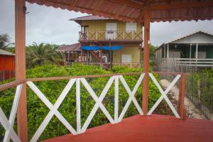 a view of a house from a balcony with a building at Nossa Casa de Praia in Ajuruteua