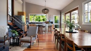 a kitchen and dining room with a table and chairs at The Welcome Paddock in Hepburn