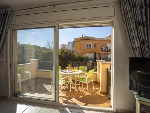 a sliding glass door leading to a patio with a table at Casa con piscina privada a 100m de la playa, ideal para familias - HISP-288-61 in Empuriabrava