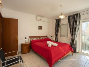 a bedroom with a red bed with a red blanket at Casa con piscina privada a 100m de la playa, ideal para familias - HISP-288-61 in Empuriabrava +28 photos