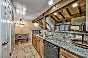a kitchen with a sink and a counter top at Lakeland Village 521 - Come Lake It in South Lake Tahoe