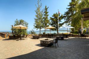 a patio with tables and chairs and umbrellas at Lakeland Village 521 - Come Lake It in South Lake Tahoe