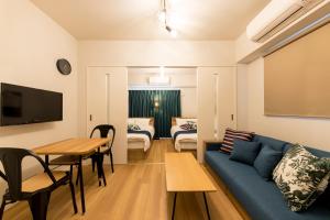 TV a/nebo společenská místnost v ubytování SG RESIDENCE INN HAKATA