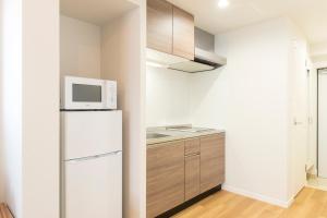Kuchyň nebo kuchyňský kout v ubytování SG RESIDENCE INN HAKATA